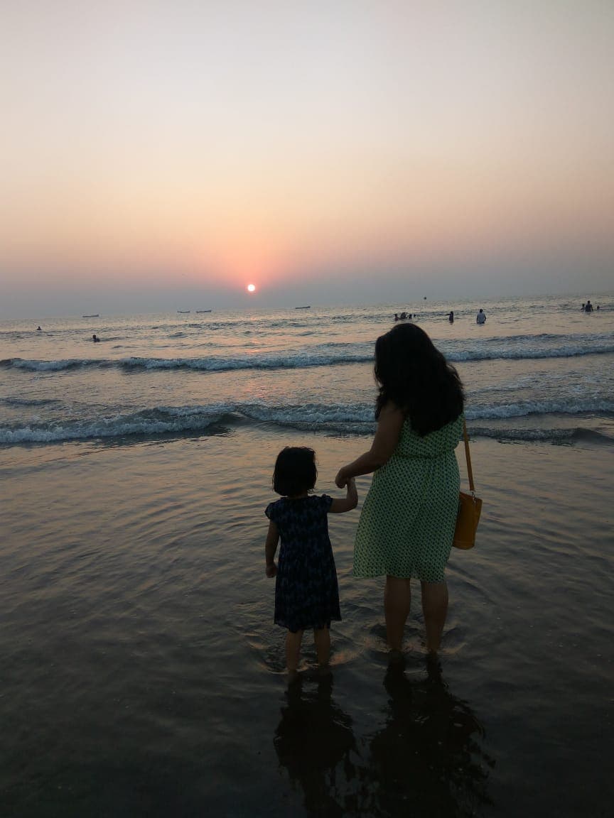 Ruchika at the beach with child